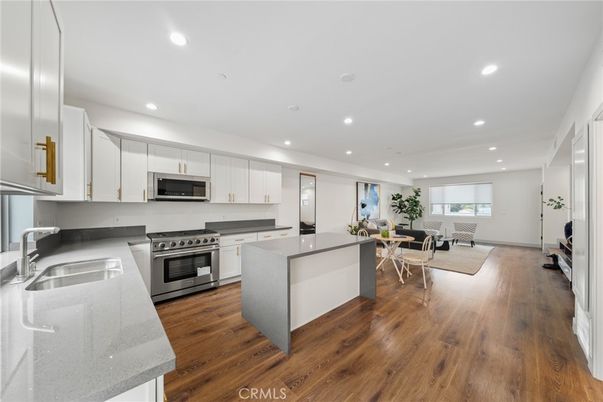 Dining room, Interior, Kitchen, Recessed Lighting, Stainless Steel Appliances, Wood Texture Flooring