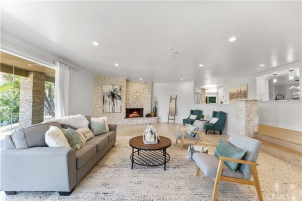 Fireplace, Interior, Living room, Recessed Lighting, Stone Walls, Wood Texture Flooring