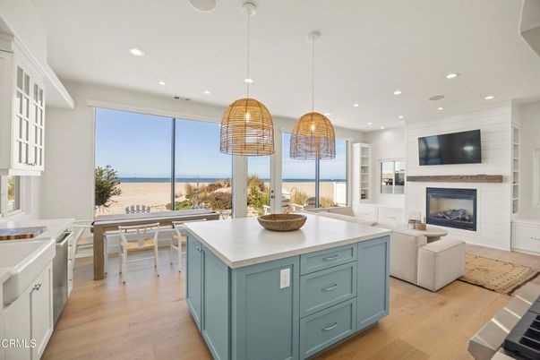 Dining room, Fireplace, Interior, Kitchen, Living room, Pendant Lights, Recessed Lighting, Water, Wood Texture Flooring