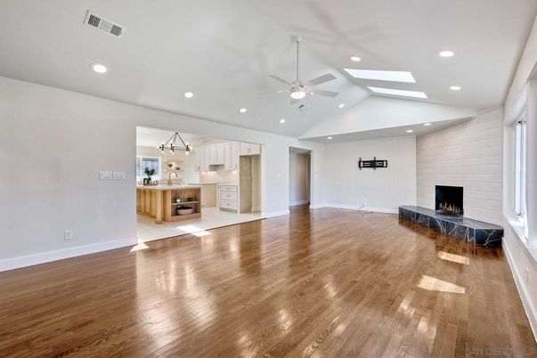 Empty room, Fireplace, Interior, Kitchen, Pendant Lights, Recessed Lighting, Wood Texture Flooring