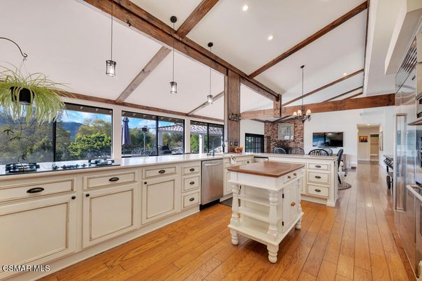 Fireplace, Interior, Kitchen, Pendant Lights, Recessed Lighting, Stainless Steel Appliances, Stone Walls, Wooden Beams, Wood Texture Flooring
