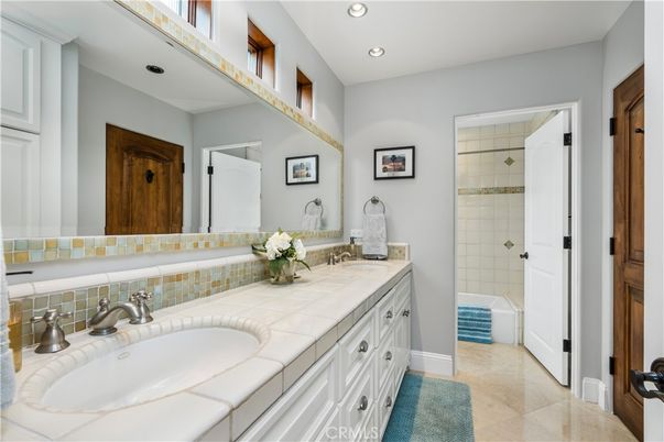 Bathroom, Dual Sink Vanities, Interior, Recessed Lighting, Tile Countertops