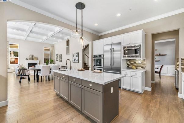 Dining room, Fireplace, Interior, Kitchen, Pendant Lights, Recessed Lighting, Stainless Steel Appliances, Wood Texture Flooring