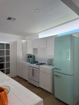 Interior, Kitchen, Recessed Lighting, Tile Countertops, Washer