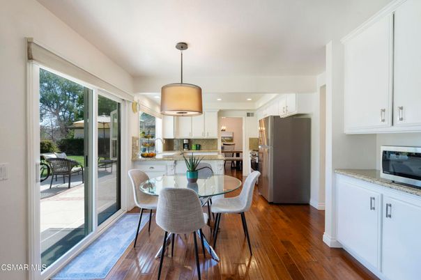Dining room, Interior, Kitchen, Pendant Lights, Recessed Lighting, Stainless Steel Appliances, Wood Texture Flooring