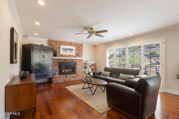 Fireplace, Interior, Living room, Recessed Lighting, Stone Walls, Wood Texture Flooring