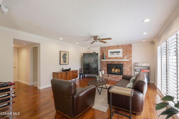 Fireplace, Interior, Living room, Recessed Lighting, Stone Walls, Wood Texture Flooring