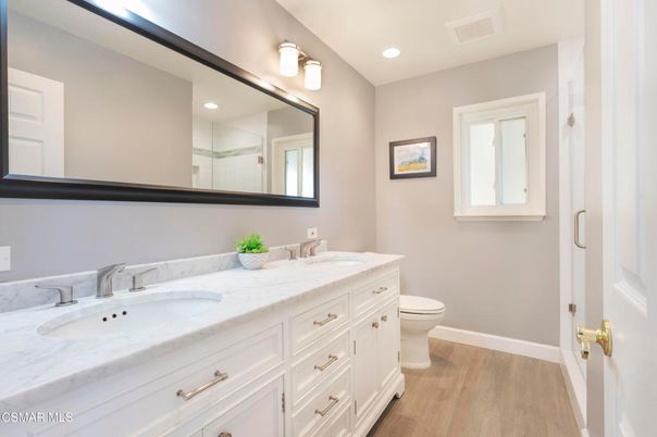 Bathroom, Dual Sink Vanities, Interior, Recessed Lighting, Wood Texture Flooring