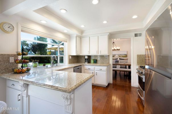 Chandelier, Dining room, Interior, Kitchen, Pendant Lights, Recessed Lighting, Stainless Steel Appliances, Wood Texture Flooring