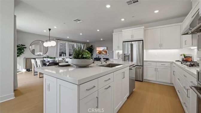 Dining room, Interior, Kitchen, Pendant Lights, Recessed Lighting, Stainless Steel Appliances, Wood Texture Flooring