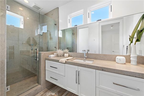 Bathroom, Dual Sink Vanities, Glass Shower, Interior, Recessed Lighting, Wood Texture Flooring