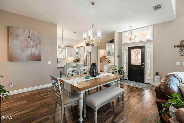 Chandelier, Dining room, Interior, Kitchen, Pendant Lights, Stainless Steel Appliances, Wood Texture Flooring
