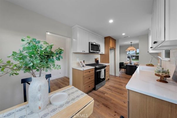 Interior, Kitchen, Pendant Lights, Recessed Lighting, Tile Countertops, Wood Texture Flooring