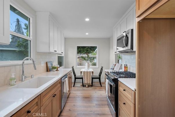 Dining room, Interior, Kitchen, Recessed Lighting, Stainless Steel Appliances, Wood Texture Flooring
