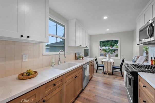 Dining room, Interior, Kitchen, Recessed Lighting, Stainless Steel Appliances, Wood Texture Flooring