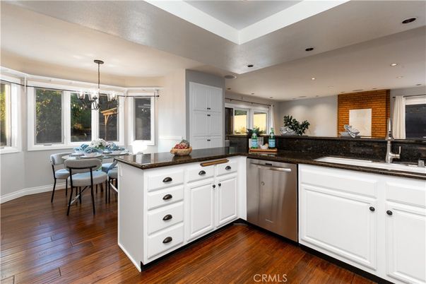 Dining room, Interior, Kitchen, Pendant Lights, Recessed Lighting, Stainless Steel Appliances, Wood Texture Flooring