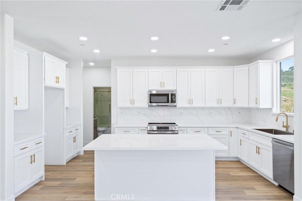 Interior, Kitchen, Marble Walls, Recessed Lighting, Stainless Steel Appliances, Wood Texture Flooring