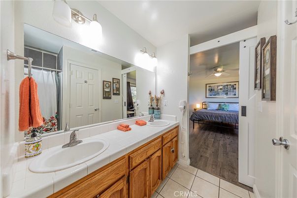 Bathroom, Bedroom, Dual Sink Vanities, Interior, Tile Countertops, Wood Texture Flooring
