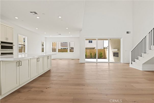 Empty room, Fireplace, Interior, Kitchen, Recessed Lighting, Wood Texture Flooring