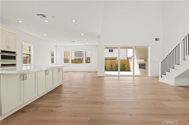 Empty room, Fireplace, Interior, Kitchen, Recessed Lighting, Wood Texture Flooring