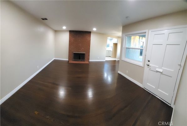 Empty room, Fireplace, Interior, Recessed Lighting, Stone Walls, Wood Texture Flooring