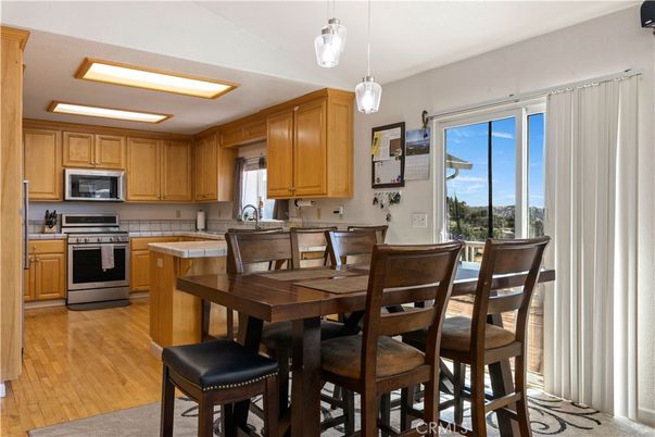 Dining room, Interior, Kitchen, Pendant Lights, Stainless Steel Appliances, Wood Texture Flooring
