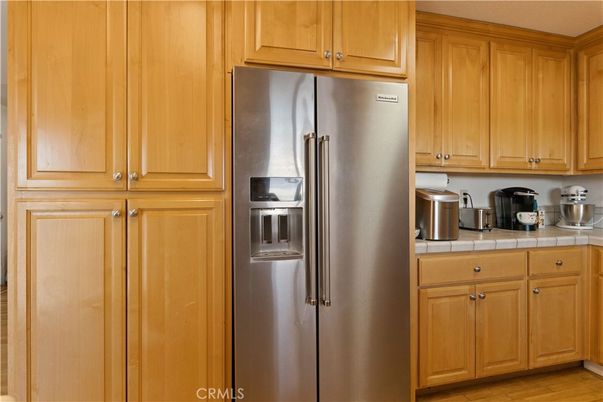 Interior, Kitchen, Stainless Steel Appliances, Tile Countertops, Wood Texture Flooring
