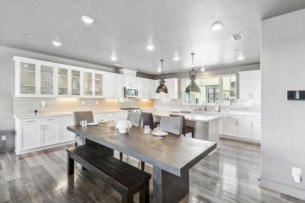 Dining room, Interior, Kitchen, Pendant Lights, Recessed Lighting, Stainless Steel Appliances, Wood Texture Flooring