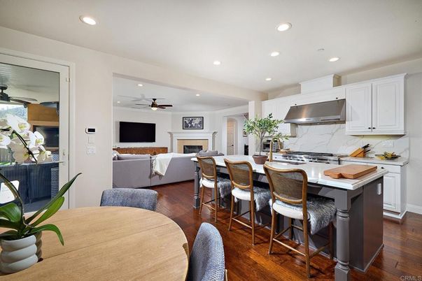 Fireplace, Interior, Kitchen, Living room, Recessed Lighting, Stainless Steel Appliances, Wood Texture Flooring