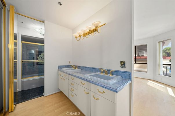 Bathroom, Dual Sink Vanities, Glass Shower, Interior, Tile Countertops, Wood Texture Flooring