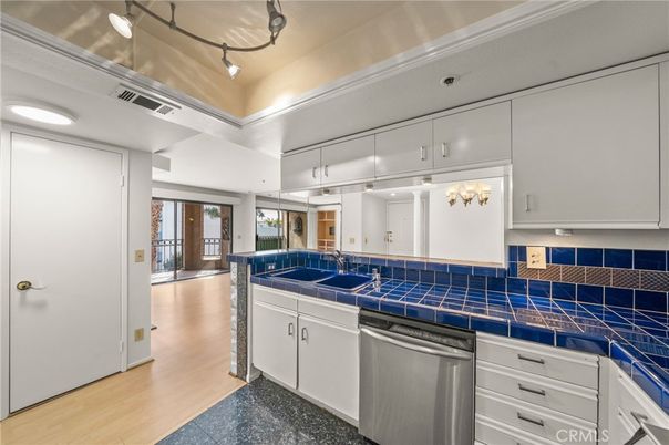 Interior, Kitchen, Recessed Lighting, Tile Countertops, Wood Texture Flooring