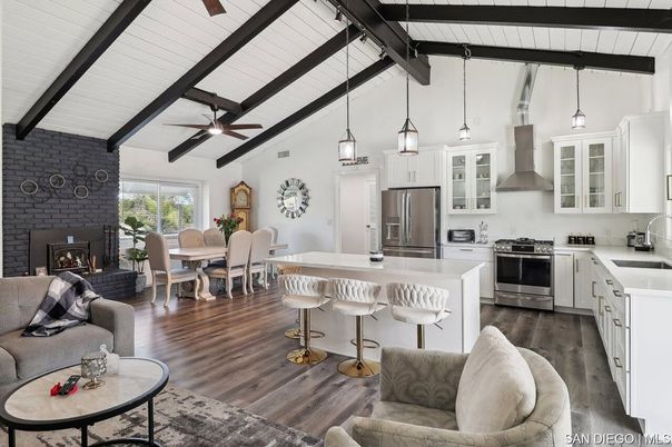 Dining room, Fireplace, Interior, Kitchen, Living room, Pendant Lights, Stainless Steel Appliances, Stone Walls, Wooden Beams, Wood Texture Flooring