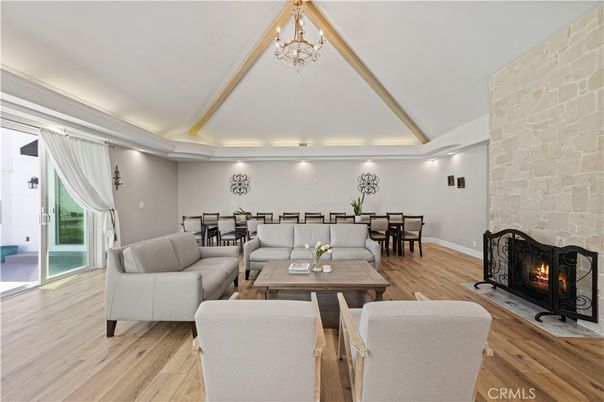 Chandelier, Dining room, Fireplace, Interior, Living room, Recessed Lighting, Stone Walls, Wood Texture Flooring