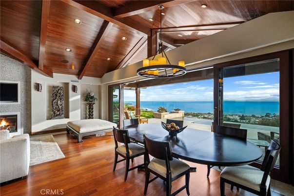 Chandelier, Dining room, Fireplace, Interior, Recessed Lighting, Water, Wooden Beams, Wooden Ceilings, Wood Texture Flooring