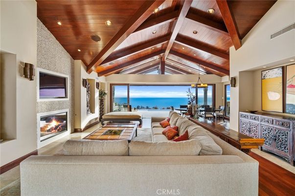 Dining room, Fireplace, Interior, Living room, Pendant Lights, Recessed Lighting, Water, Wooden Beams, Wooden Ceilings, Wood Texture Flooring