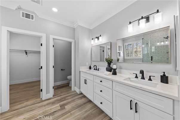 Bathroom, Dual Sink Vanities, Glass Shower, Interior, Recessed Lighting, Wood Texture Flooring