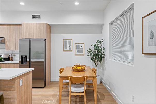 Dining room, Interior, Kitchen, Recessed Lighting, Stainless Steel Appliances, Wood Texture Flooring