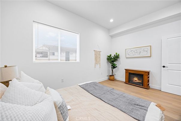 Bedroom, Fireplace, Interior, Recessed Lighting, Wood Texture Flooring