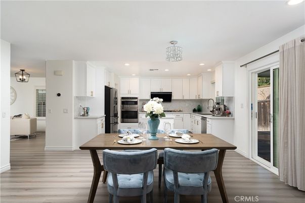 Dining room, Interior, Kitchen, Pendant Lights, Recessed Lighting, Stainless Steel Appliances, Wood Texture Flooring