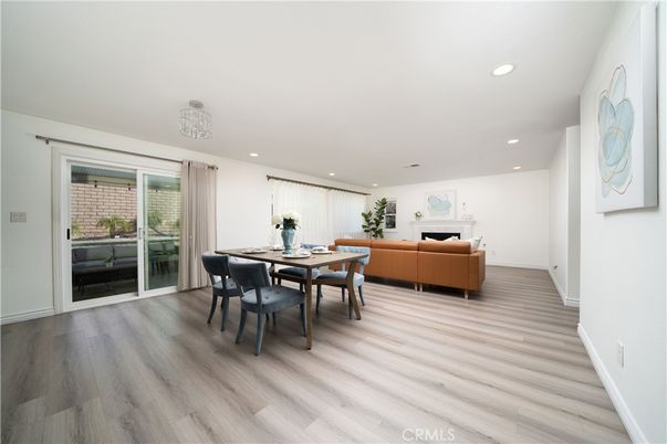 Dining room, Fireplace, Interior, Living room, Recessed Lighting, Wood Texture Flooring