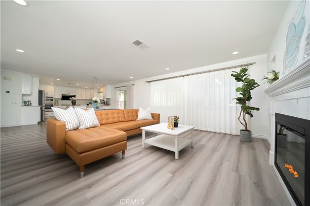 Fireplace, Interior, Kitchen, Living room, Pendant Lights, Recessed Lighting, Stainless Steel Appliances, Wood Texture Flooring