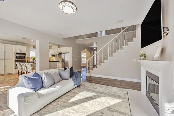 Fireplace, Interior, Kitchen, Living room, Recessed Lighting, Stainless Steel Appliances, Wood Texture Flooring