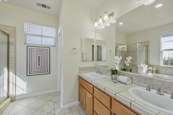 Bathroom, Dual Sink Vanities, Glass Shower, Interior, Recessed Lighting, Tile Countertops