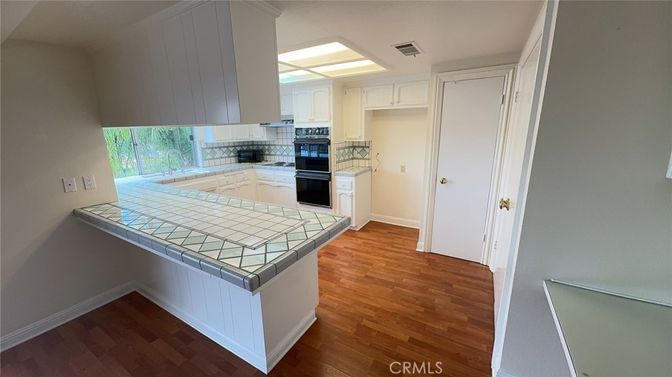 Interior, Kitchen, Tile Countertops, Wood Texture Flooring