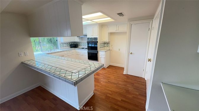 Interior, Kitchen, Tile Countertops, Wood Texture Flooring