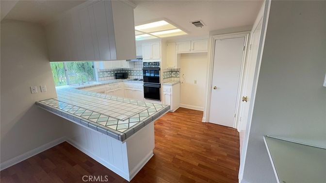 Interior, Kitchen, Tile Countertops, Wood Texture Flooring