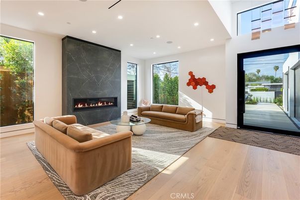 Fireplace, Interior, Living room, Marble Walls, Recessed Lighting, Wood Texture Flooring