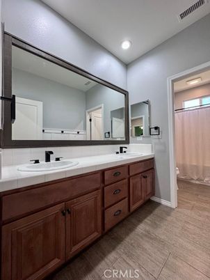 Bathroom, Dual Sink Vanities, Interior, Recessed Lighting, Tile Countertops, Wood Texture Flooring