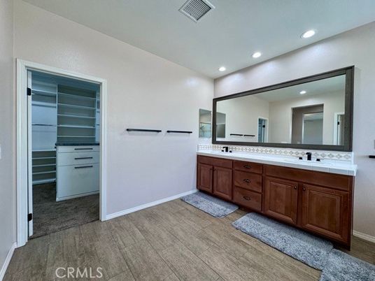 Bathroom, Dual Sink Vanities, Interior, Recessed Lighting, Tile Countertops, Wood Texture Flooring