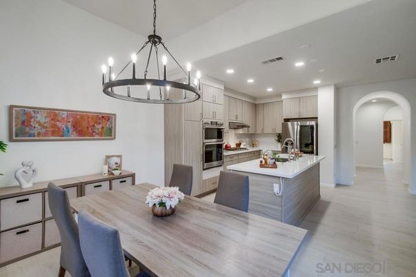 Chandelier, Dining room, Interior, Kitchen, Pendant Lights, Recessed Lighting, Stainless Steel Appliances, Wood Texture Flooring